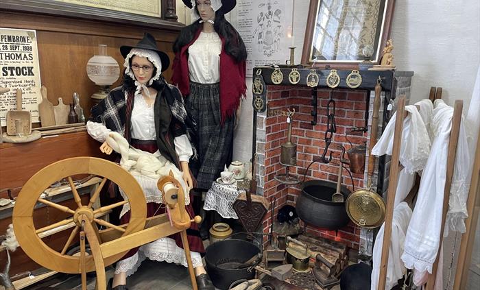 Collection of authentic 19th Century Welsh costume with down-hearth fire and artefacts